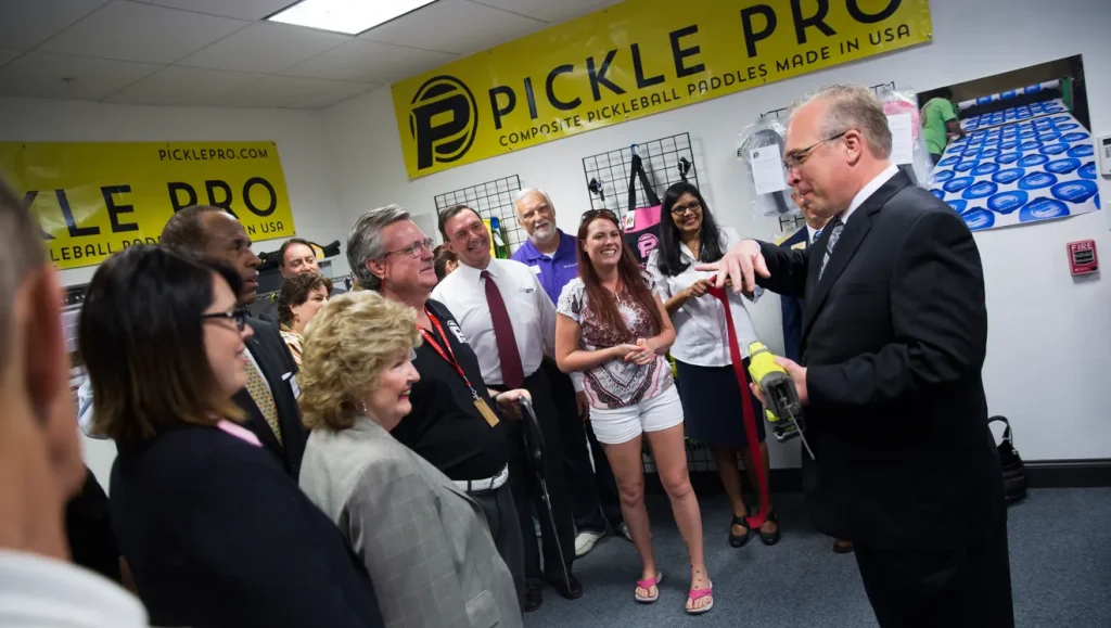 Todd Pree at the grand opening of the retail store he founded, featured in the Naples Daily News, celebrating the launch of his innovative business venture.